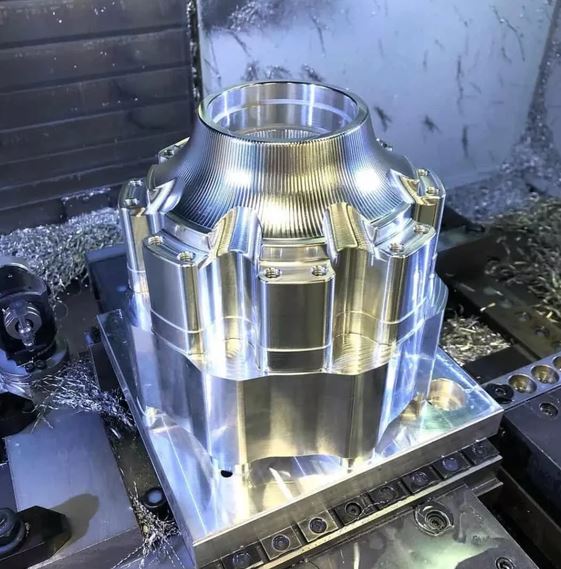 CNC mill cutting a finished aluminum part